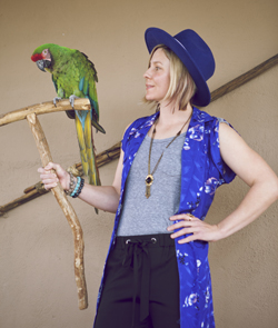 Keeper Allison models a blue Buffalo Exchange jacket with a Macaw
