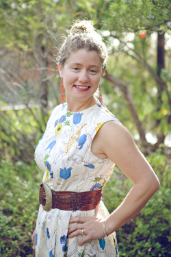 Researcher Clare models a white floral Buffalo Exchange dress