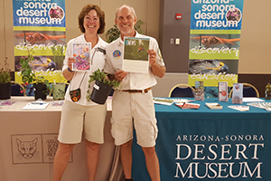 Two docents manning an event booth