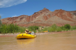 Yellow inflatable boat on river