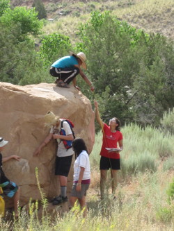 Group examining rock