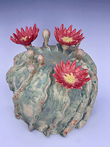 A sample centerpiece = pottery cactus in bloom