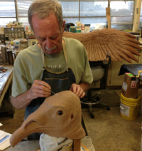 Exhibits staff sculpting vulture head